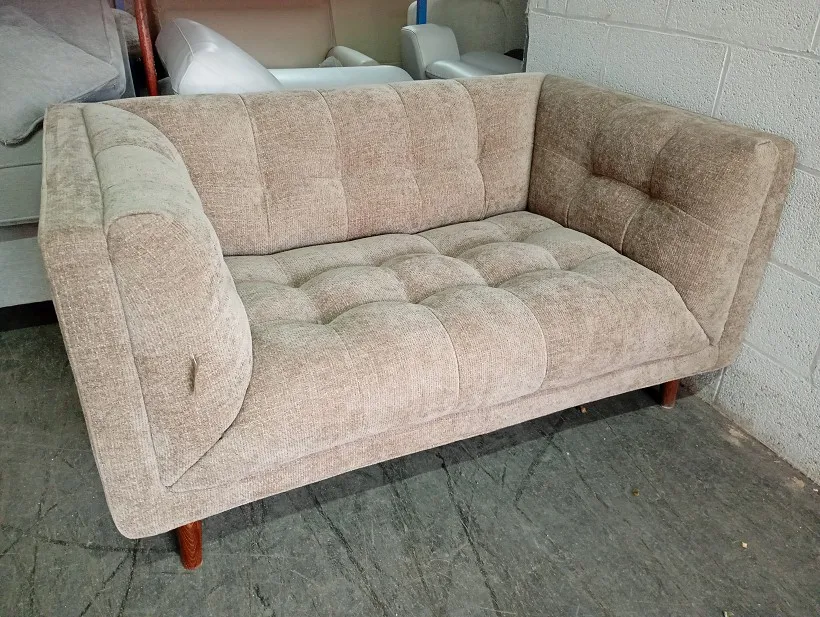 Beige textured fabric 2 seater sofa with deep button tufted seat and back, wooden legs