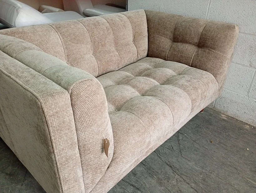 Beige textured fabric 2 seater sofa with deep button tufted seat and back