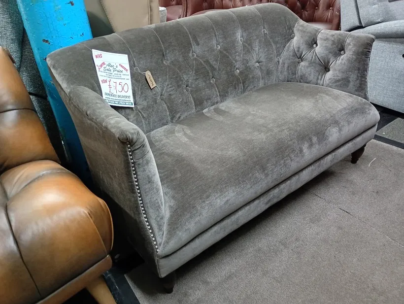 Grey velvet buttoned 2 seater sofa with high back and studded arms