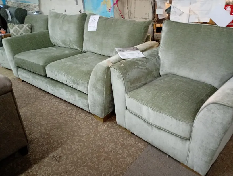 Sage green textured fabric 3 seater sofa and matching armchair with pillow back cushions and wooden feet