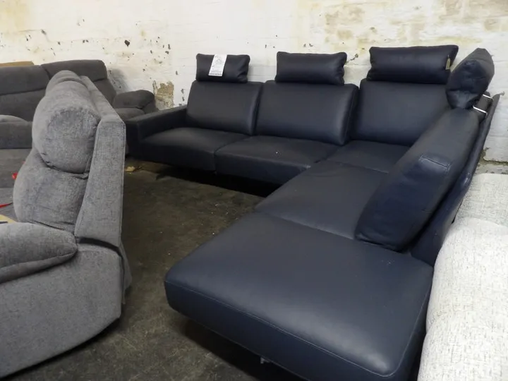 Black leather corner sofa with adjustable headrests