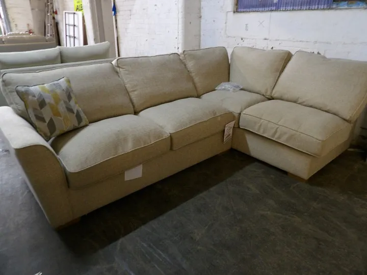 Beige fabric corner sofa with deep seat cushions