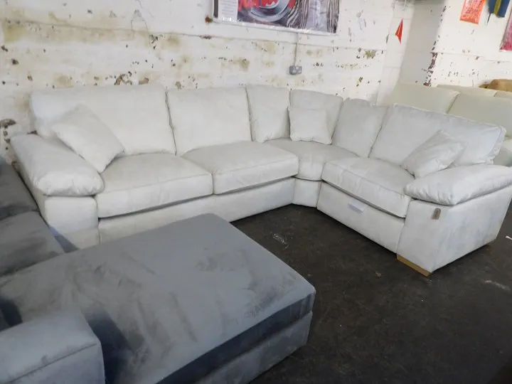 Large cream fabric corner sofa with deep cushions